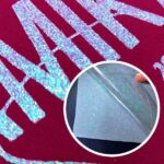 exemplo de aplicação do Filme de recorte Glitter translúcido em um tecido vermelho