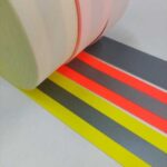 rolos de faixa refletiva antichamas amarela, laranja e cinza