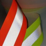 detalhe dos rolos de faixa refletiva antichamas no escuro refletindo a luz